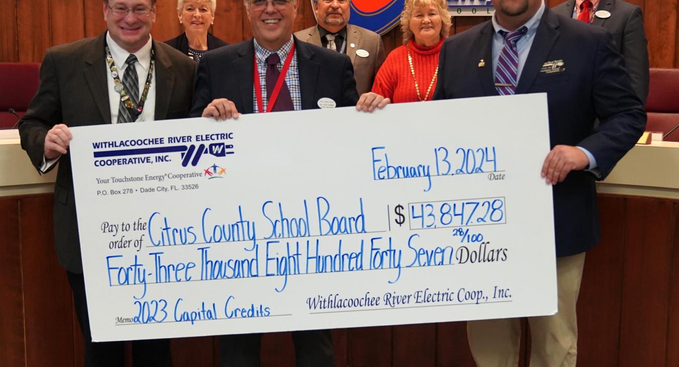 WREC Presents Citrus County School Board with Capital Credit Refund Check