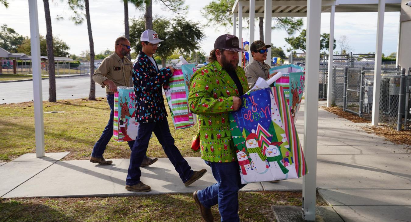 WREC Delivers Angel Tree Gifts to Fox Hollow Elementary School