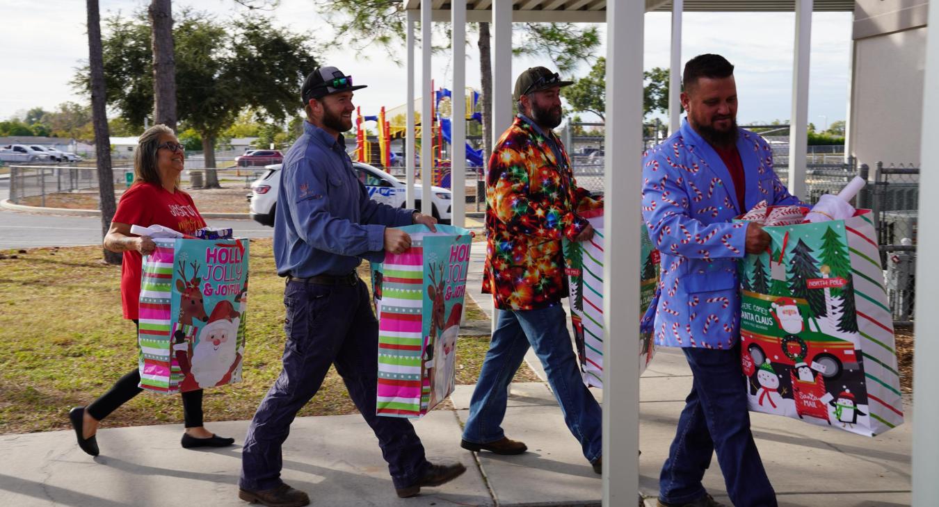 WREC Delivers Angel Tree Gifts to Fox Hollow Elementary School