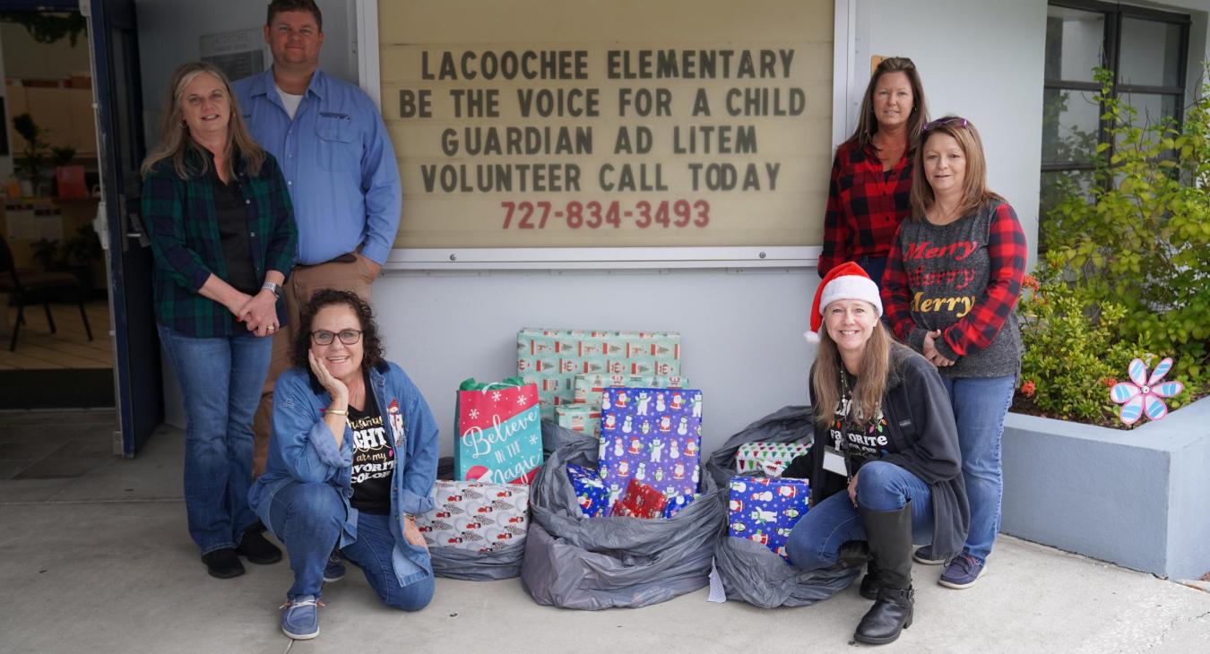 WREC's General Office employees deliver Angel Tree presents