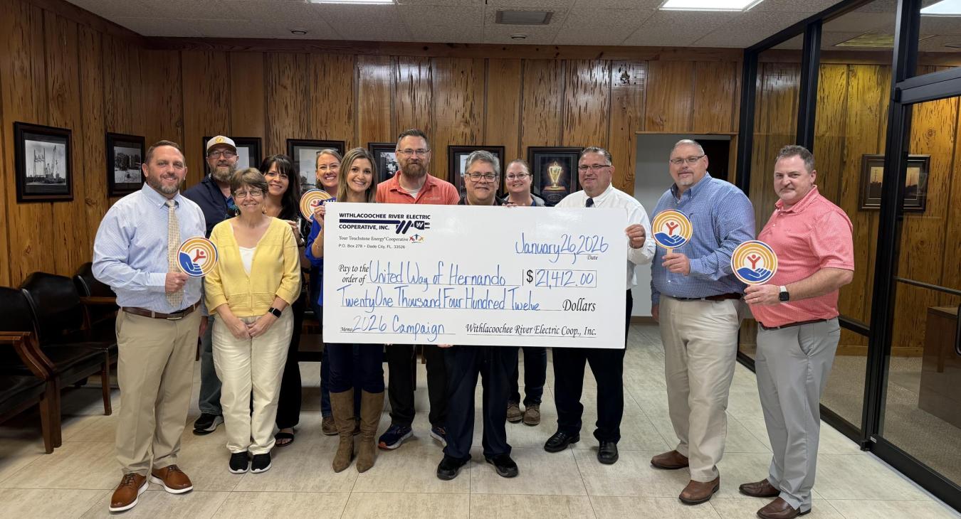 WREC presents United Way of Hernando County with a $21,412.00 donation check