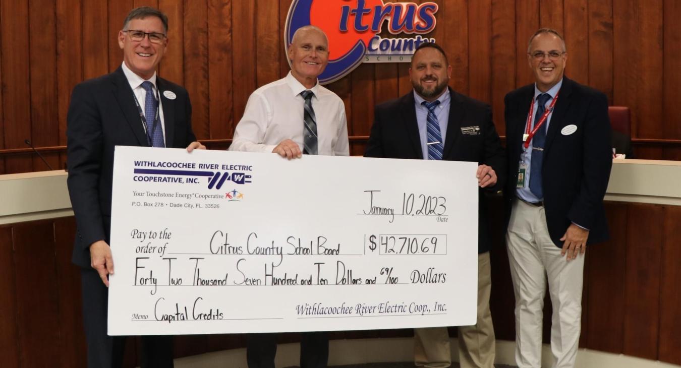 WREC presents Citrus County School Board with their 2022 Capital Credits refund check